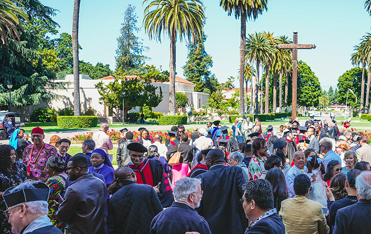 A crowd outside Mission Church featuring pastoral, theology and religious studies members